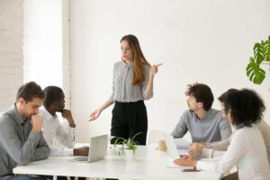 Business people having conflict at group meeting