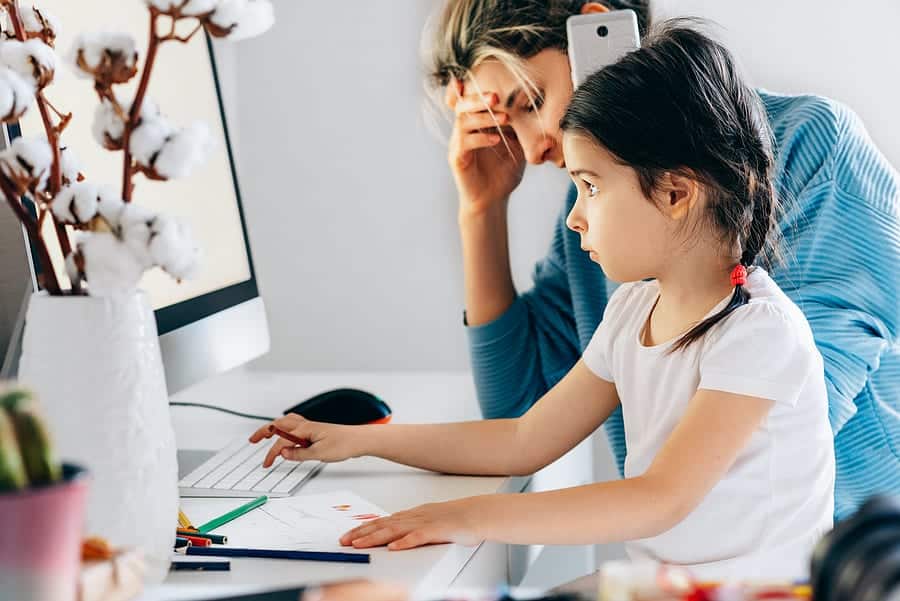 Mom and daughter in front of computer